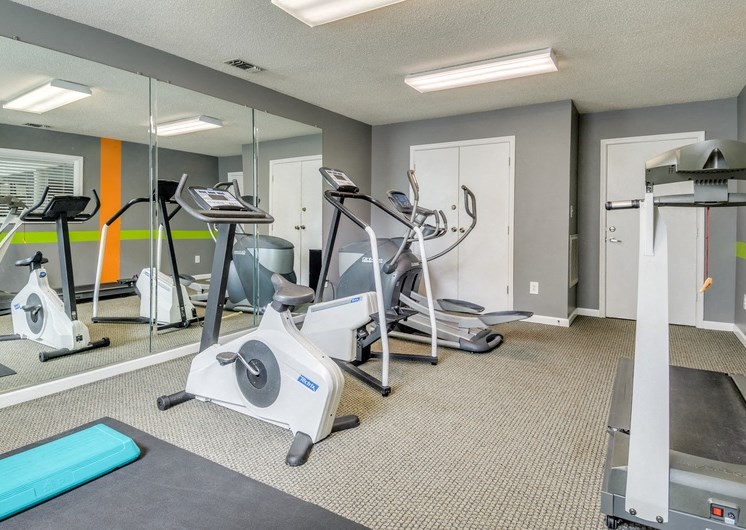 Fitness center with treadmill and stationary bikes